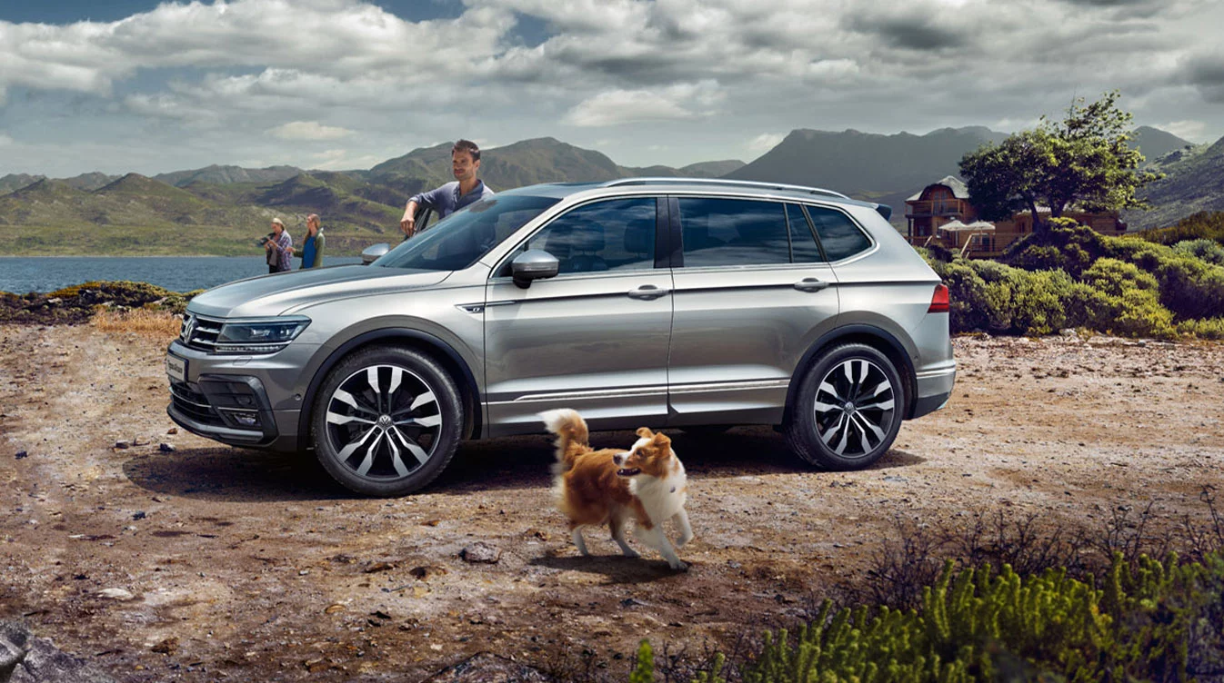 Silver Volkswagen Tiguan parked on a trail