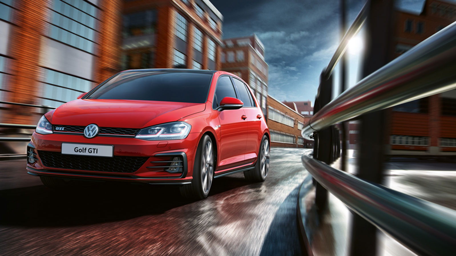 Red VW Golf GTI on a city street